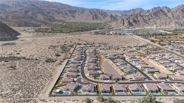 bird's eye view featuring a water and mountain view