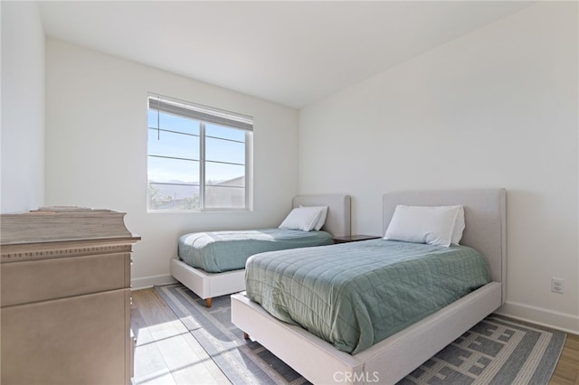 bedroom with wood-type flooring