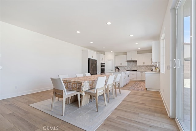 dining room with light wood-type flooring