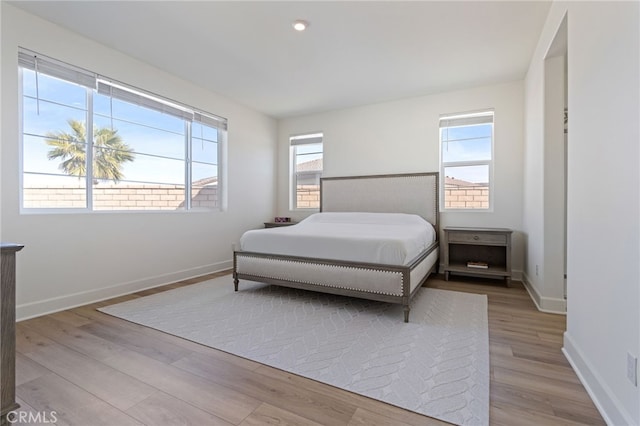 bedroom with light wood-type flooring