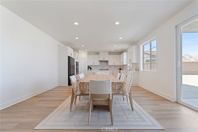 dining room featuring light hardwood / wood-style floors