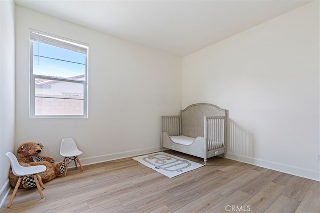 unfurnished room with light wood-type flooring