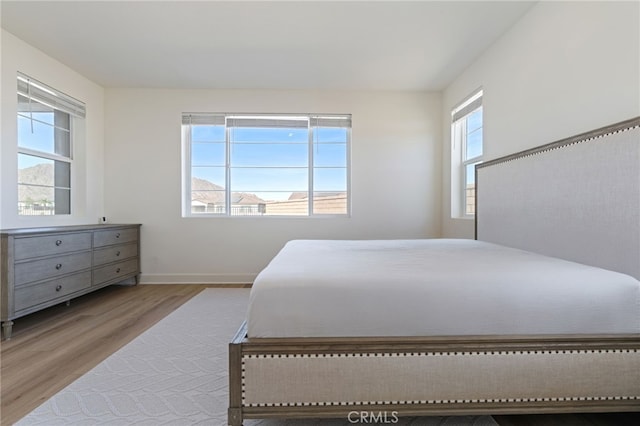 bedroom with light hardwood / wood-style flooring