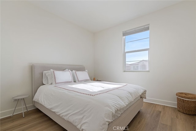 bedroom featuring hardwood / wood-style flooring