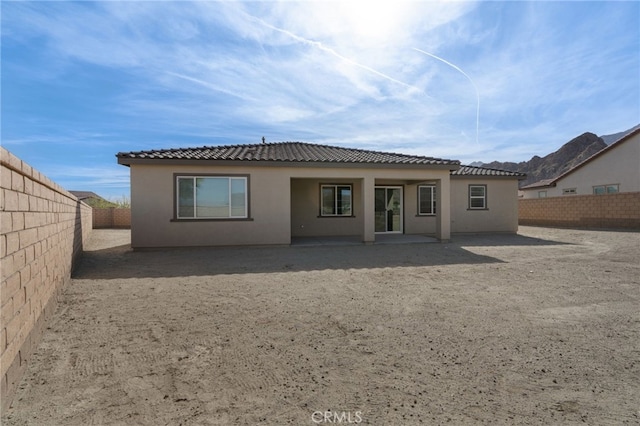 back of property featuring a patio