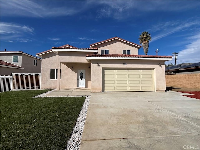 mediterranean / spanish-style home with a garage and a front yard