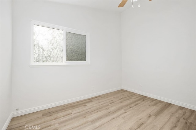 empty room featuring ceiling fan and light hardwood / wood-style floors