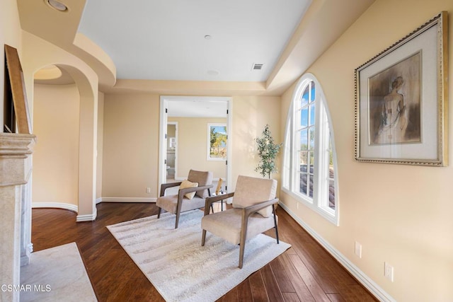 living area with dark wood-type flooring