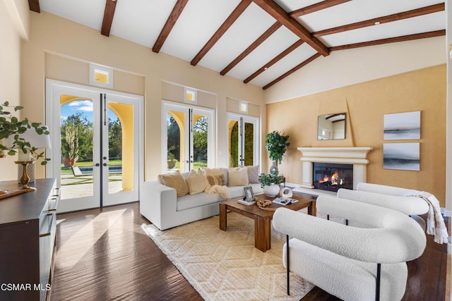 living room featuring beamed ceiling, high vaulted ceiling, light hardwood / wood-style floors, and french doors