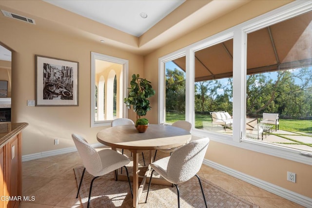 dining space with light tile patterned floors