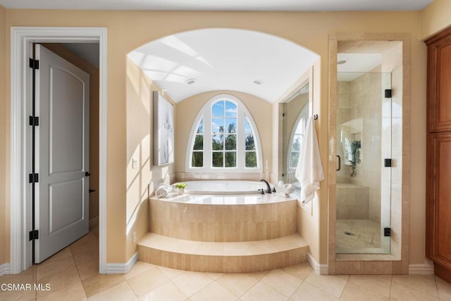 bathroom featuring independent shower and bath and tile patterned flooring