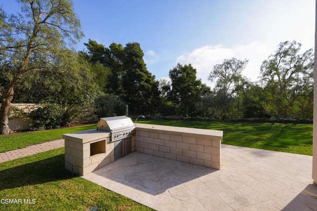 view of patio featuring grilling area and exterior kitchen