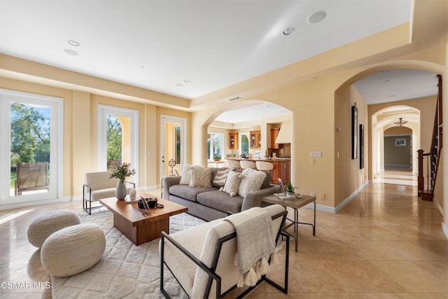 living room featuring a tray ceiling