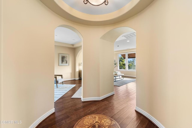 hall with dark hardwood / wood-style flooring