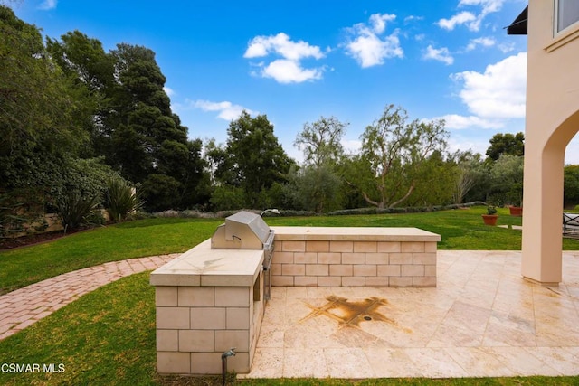 view of patio featuring grilling area and an outdoor kitchen