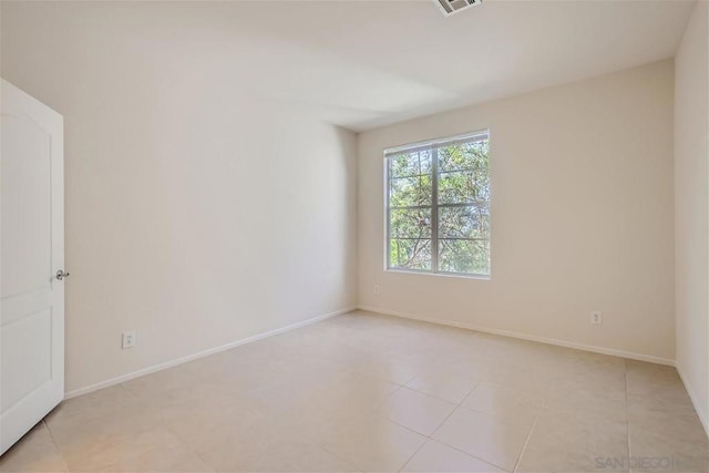 empty room with light tile patterned flooring