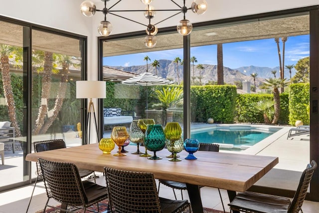 interior space with a mountain view and a notable chandelier