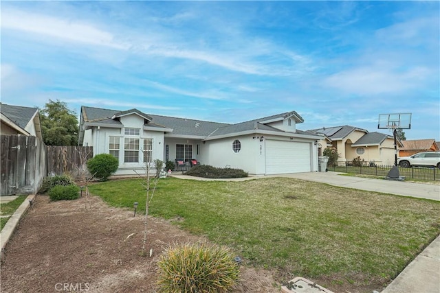 ranch-style house featuring a garage and a front lawn