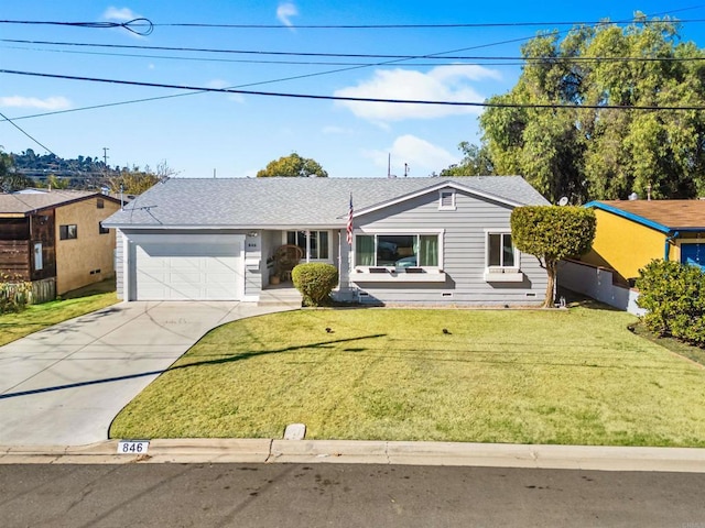 single story home featuring a garage and a front lawn