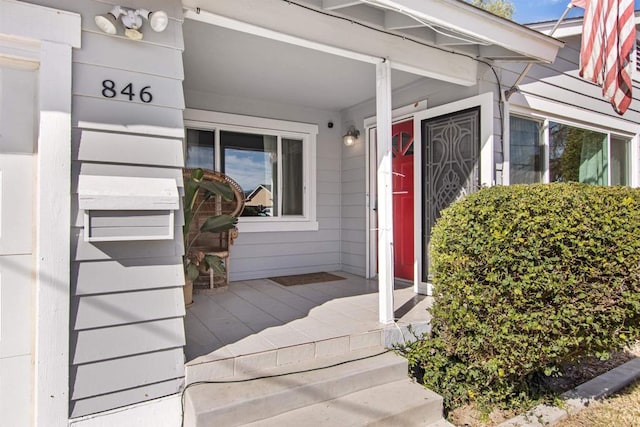 property entrance with covered porch