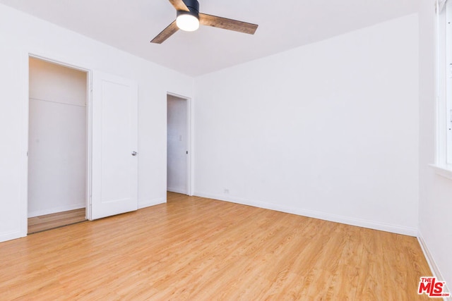 unfurnished bedroom with ceiling fan and light hardwood / wood-style floors