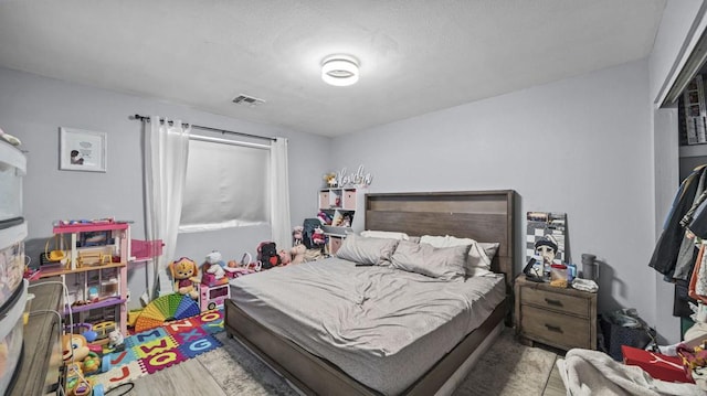 bedroom with hardwood / wood-style flooring