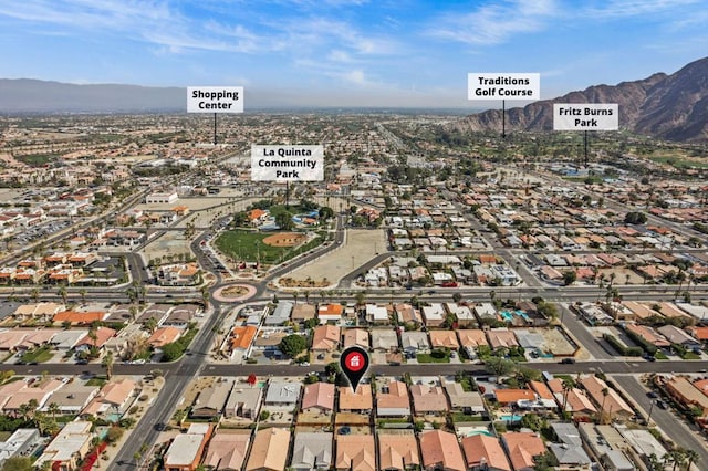 birds eye view of property with a mountain view