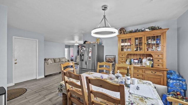 dining area with light hardwood / wood-style floors