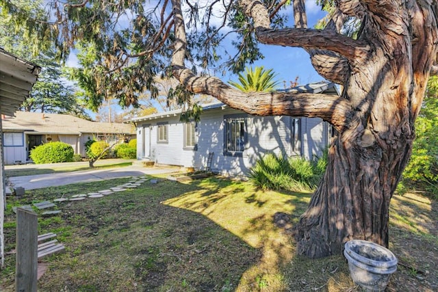 view of property exterior featuring a yard