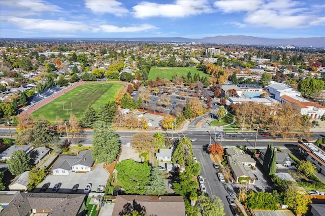 birds eye view of property with a mountain view