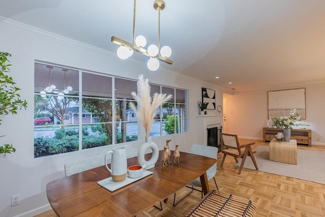 dining space with parquet floors, crown molding, and a chandelier