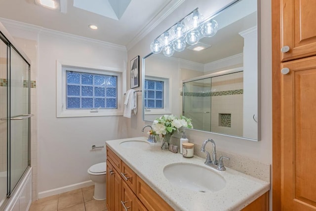 full bathroom with tile patterned floors, toilet, combined bath / shower with glass door, ornamental molding, and vanity