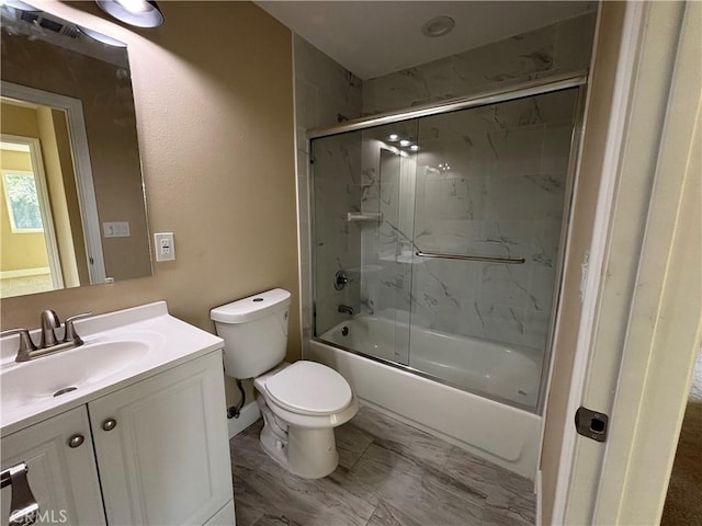 full bathroom with vanity, toilet, and combined bath / shower with glass door