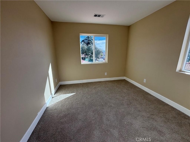 view of carpeted spare room