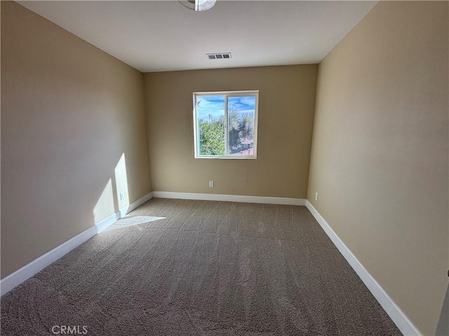 spare room featuring carpet flooring