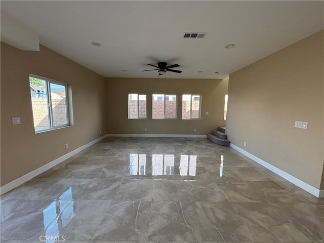 unfurnished room with ceiling fan