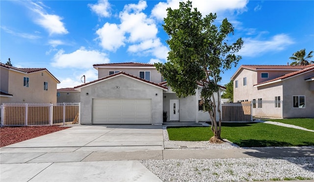 mediterranean / spanish home with fence, driveway, an attached garage, and stucco siding