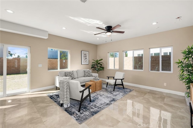 living room featuring recessed lighting and baseboards