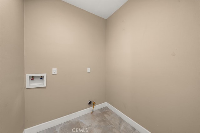 laundry area featuring laundry area, hookup for a washing machine, and baseboards