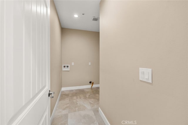 clothes washing area featuring laundry area, baseboards, visible vents, and washer hookup