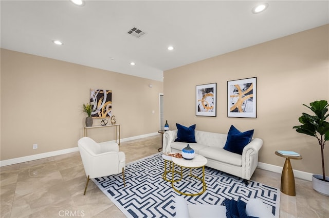 living room with recessed lighting, visible vents, and baseboards