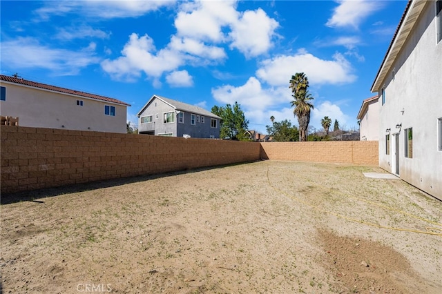 view of yard featuring a fenced backyard