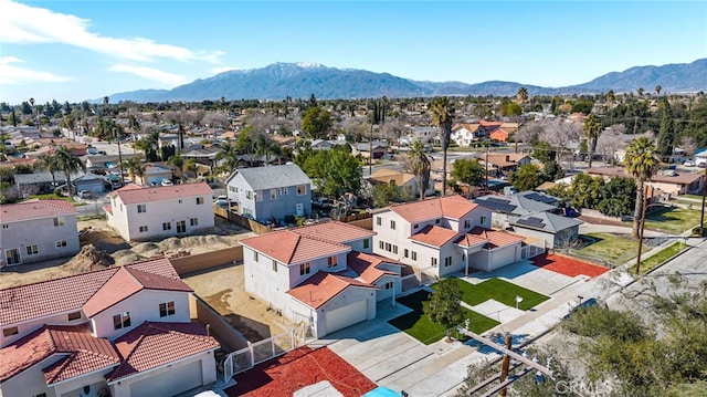 birds eye view of property featuring a mountain view and a residential view