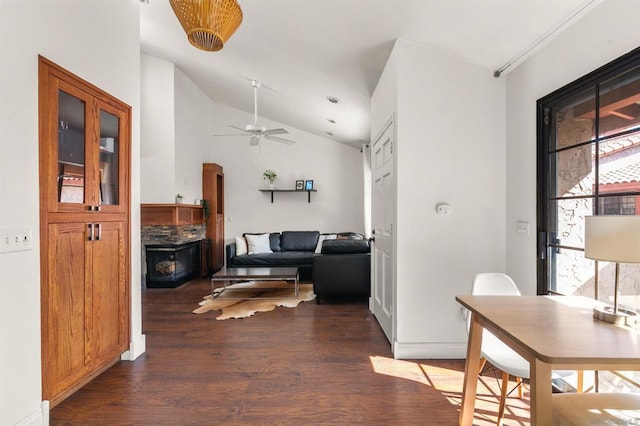 living room with vaulted ceiling, dark wood-type flooring, and ceiling fan