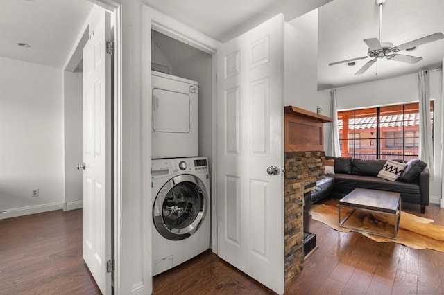 washroom featuring dark hardwood / wood-style floors, ceiling fan, and stacked washing maching and dryer