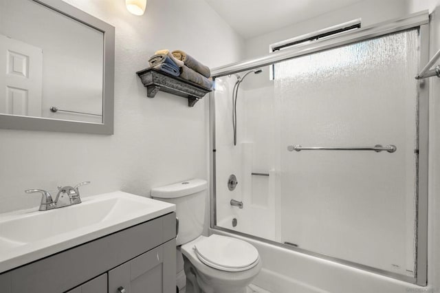 full bathroom with toilet, vanity, and shower / bath combination with glass door