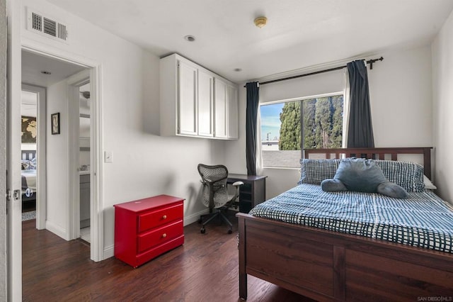 bedroom featuring dark hardwood / wood-style flooring