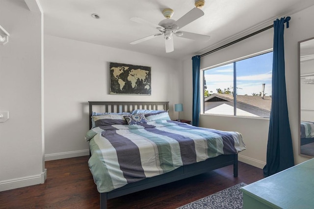 bedroom featuring dark hardwood / wood-style floors and ceiling fan