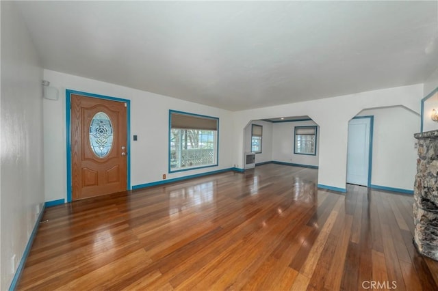 unfurnished living room with hardwood / wood-style flooring