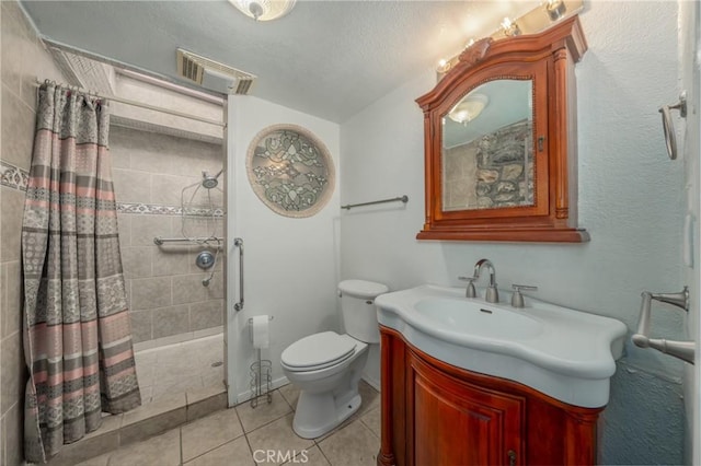 bathroom featuring vanity, a shower with curtain, tile patterned floors, and toilet